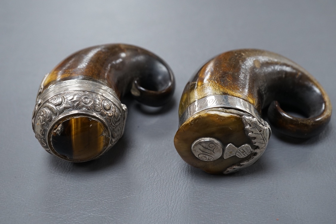Two 19th century white metal mounted horn snuff mulls, one engraved 'John Calder', the other with inset tiger's eye quartz cabochon, both a.f., largest 83mm.